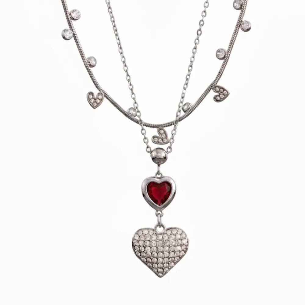 A 2-piece layered necklace set in silver, featuring a choker chain and a pendant chain with two hearts.