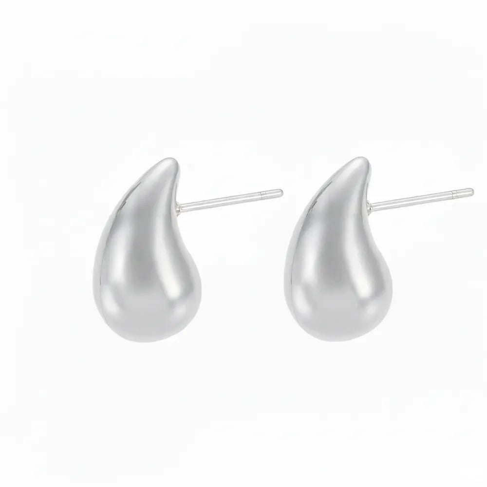 Pair of Aella Teardrop Stud Earrings in polished 316L stainless steel.