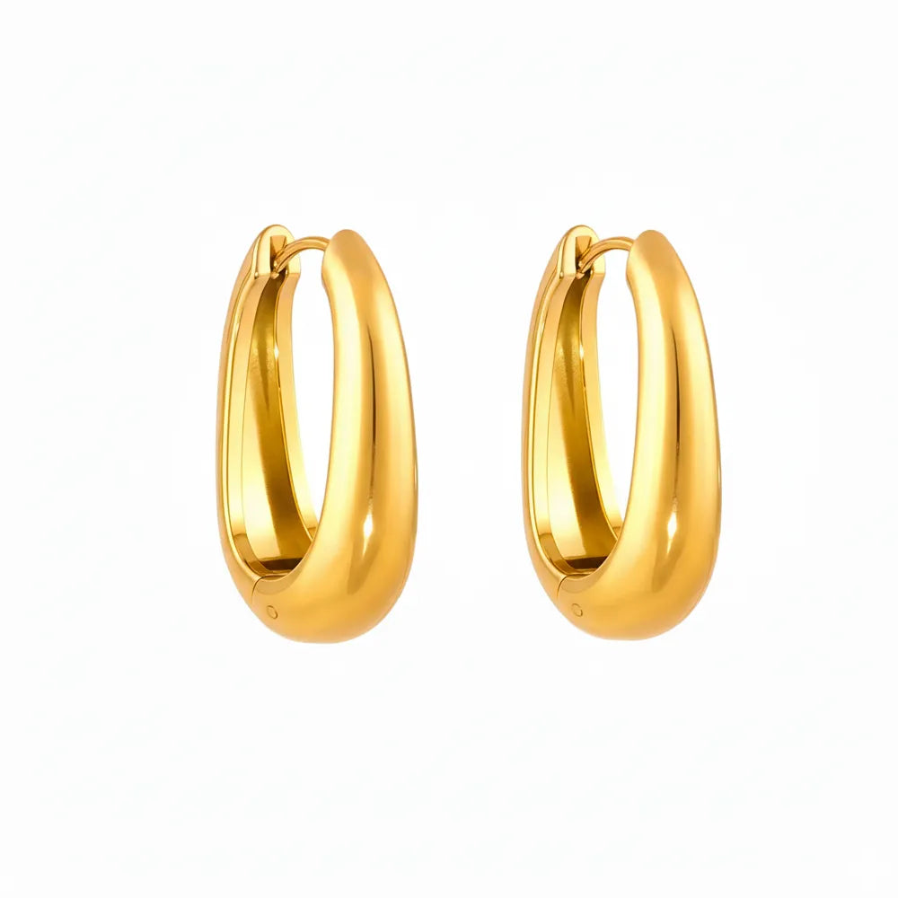 Pair of Anya Sculptural Hoop Earrings in a polished 18k gold plate finish.
