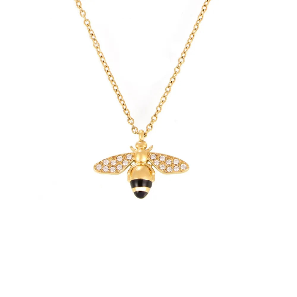 Apia Pavé Bee Charm Necklace in 18k gold with zirconia and black enamel.