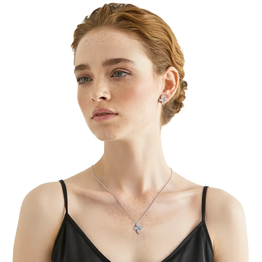 Model wearing the S925 sterling silver Auriella Pavé Clover Necklace and Stud Earrings set