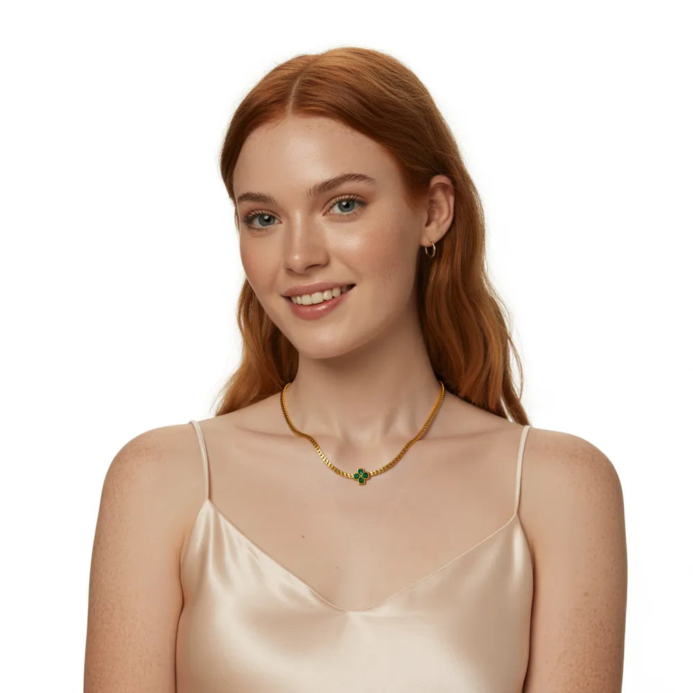 Woman showcasing the elegant style of the gold herringbone chain with a single green clover.