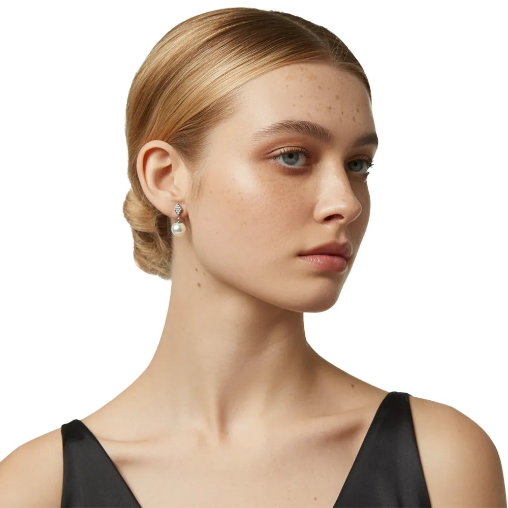 Model wearing the S925 sterling silver Elara Pavé Kite & Pearl Drop Earrings
