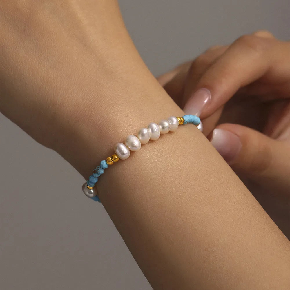 Adjustable blue stone beaded bracelet with pearl charms and gold spacer beads. Stackable summer wristwear