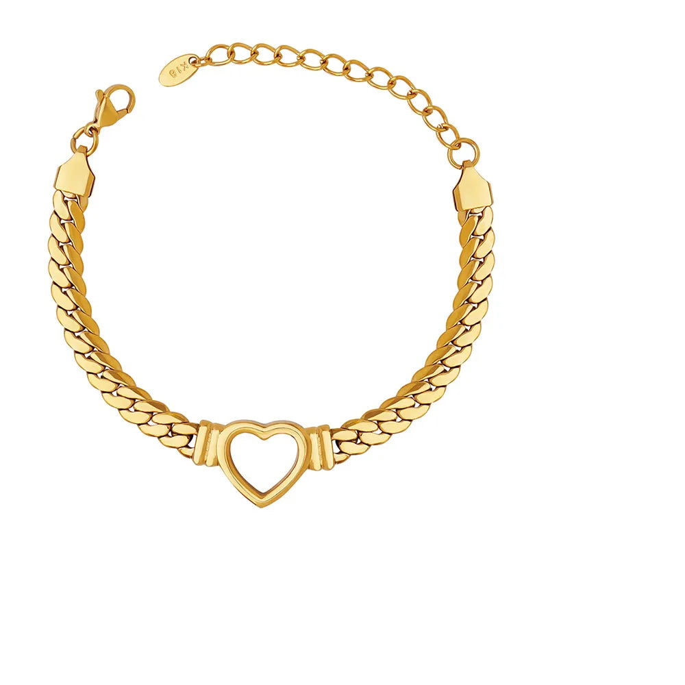 The Harlow Chunky Heart Bracelet in 18k gold plate, featuring a hollow heart pendant and thick chain, on a white background.