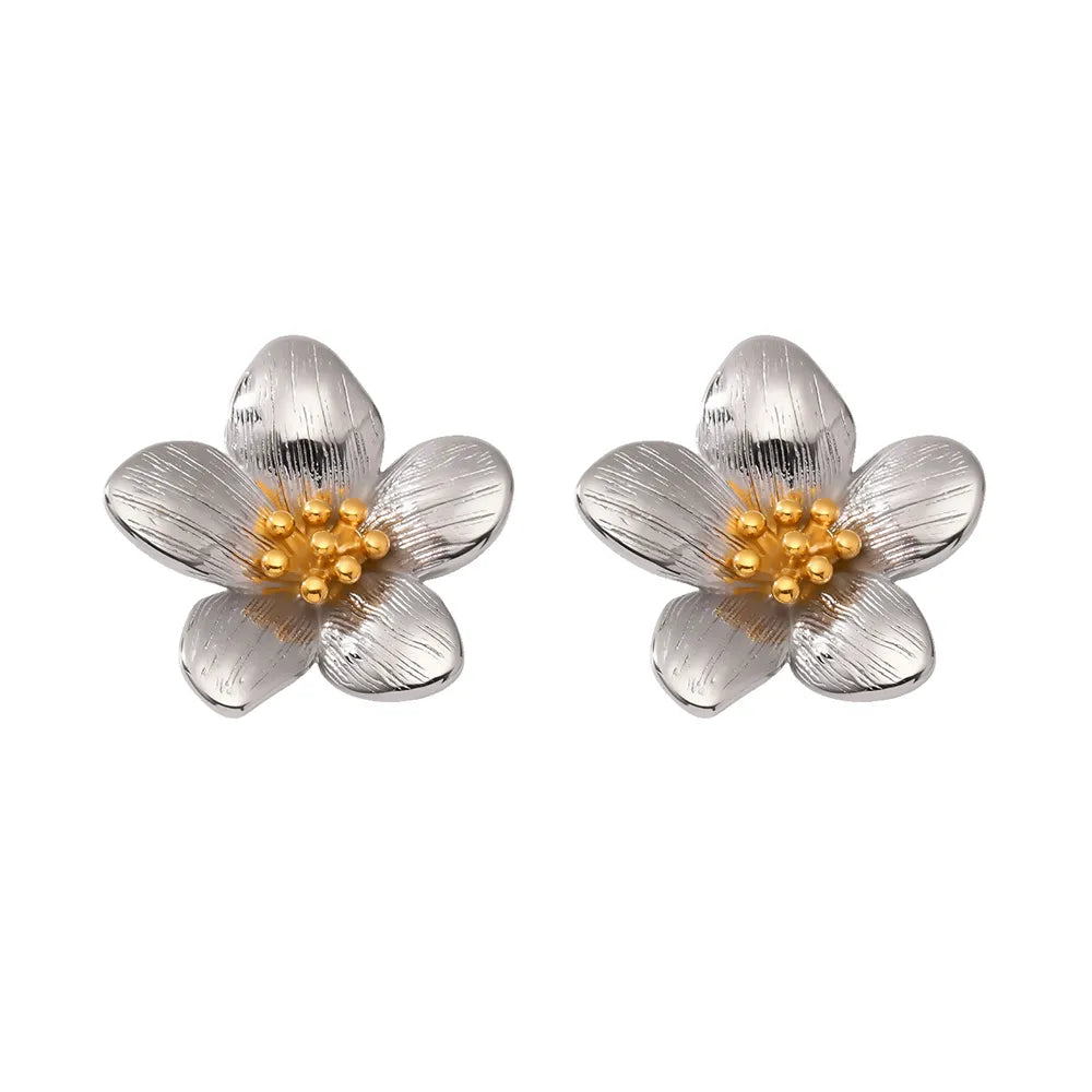 Pair of Helia Statement Flower Studs in polished stainless steel with a contrasting gold center