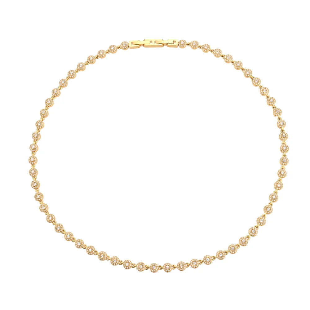 A close-up of the Lucia Zirconia Necklace in 18k gold plate, showing the brilliant round-cut stones