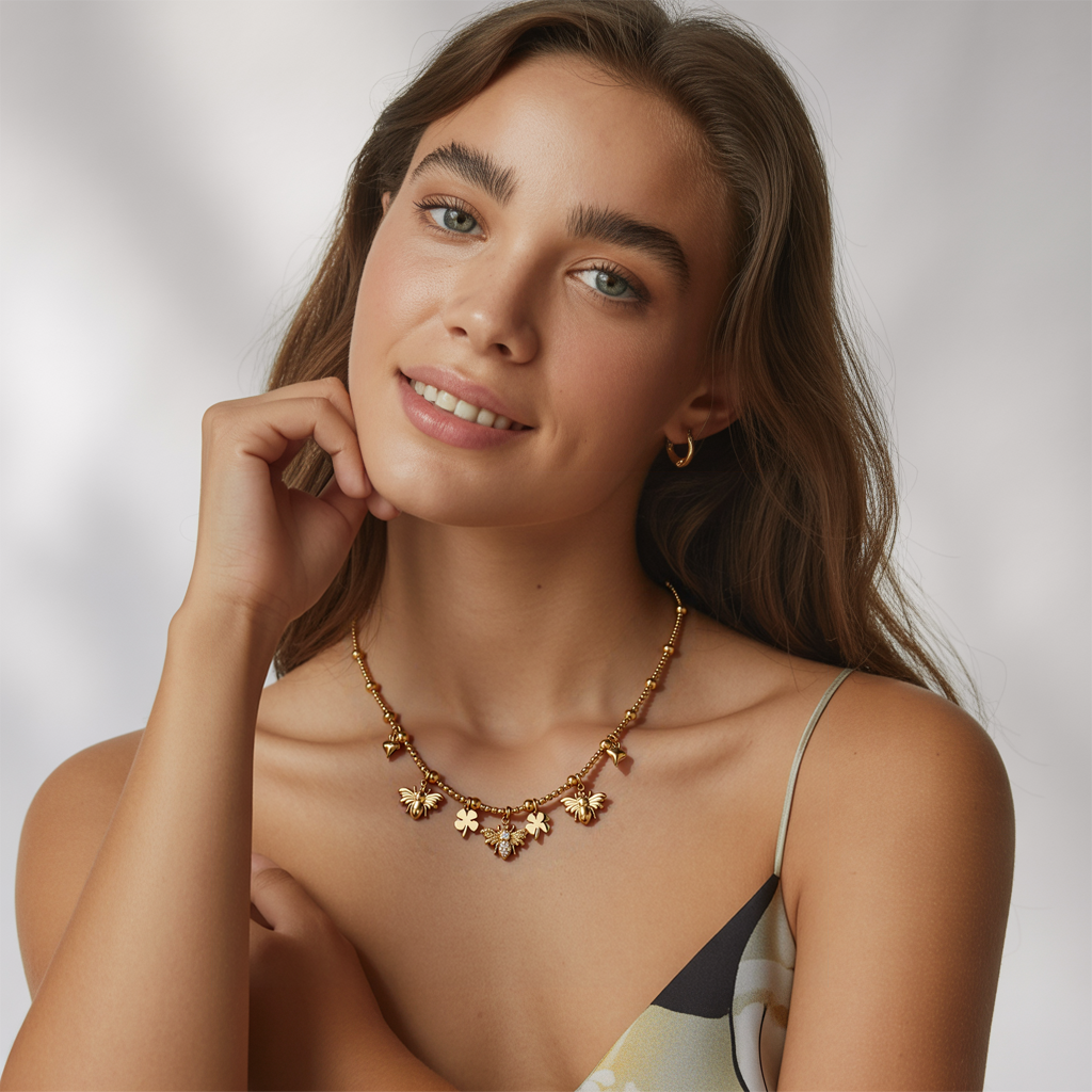 Woman showcasing the whimsical style of the gold charm necklace with bee and clover motifs