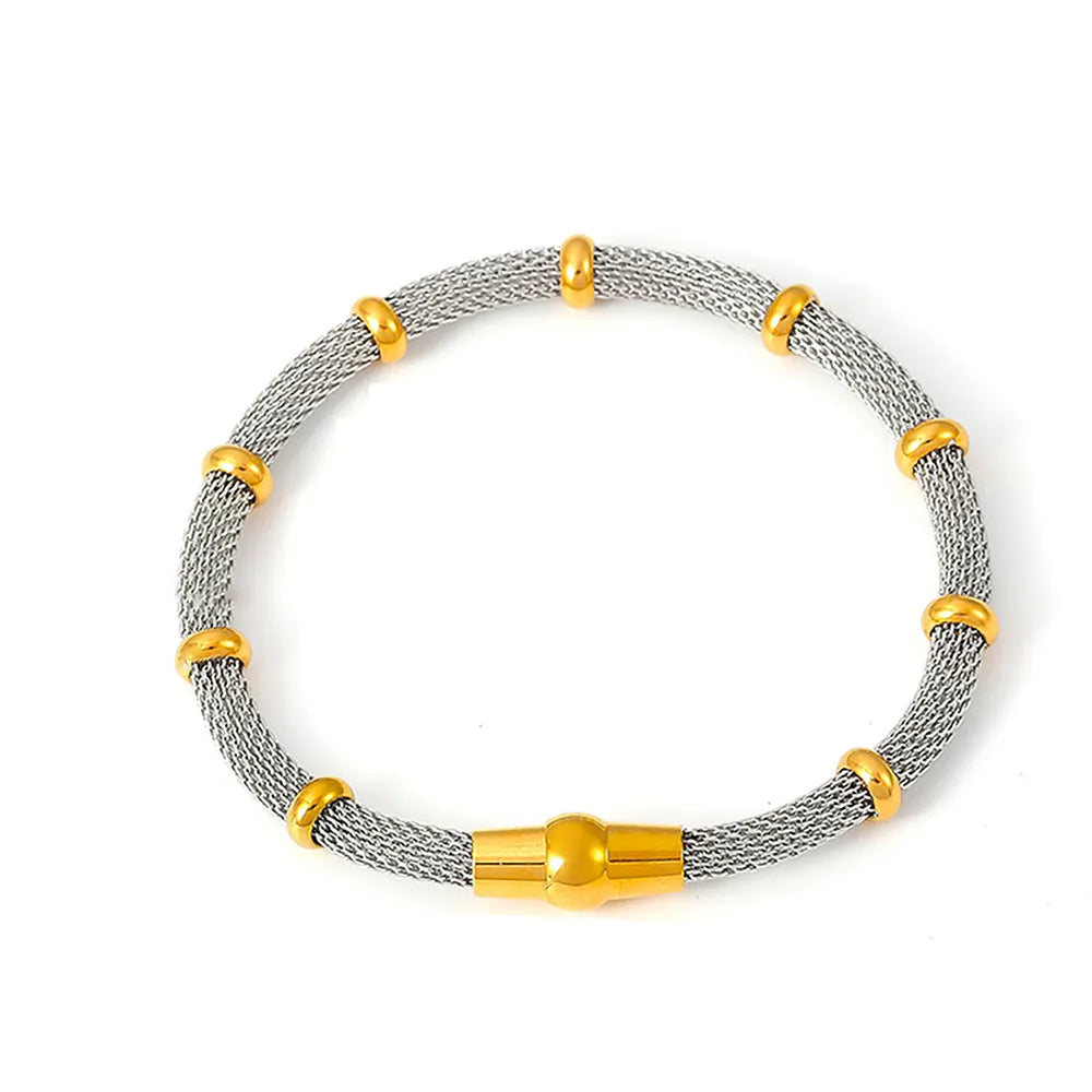 A product shot of the Milanese Weave Bracelet in a sophisticated two-tone (gold and silver) finish with bamboo details.
