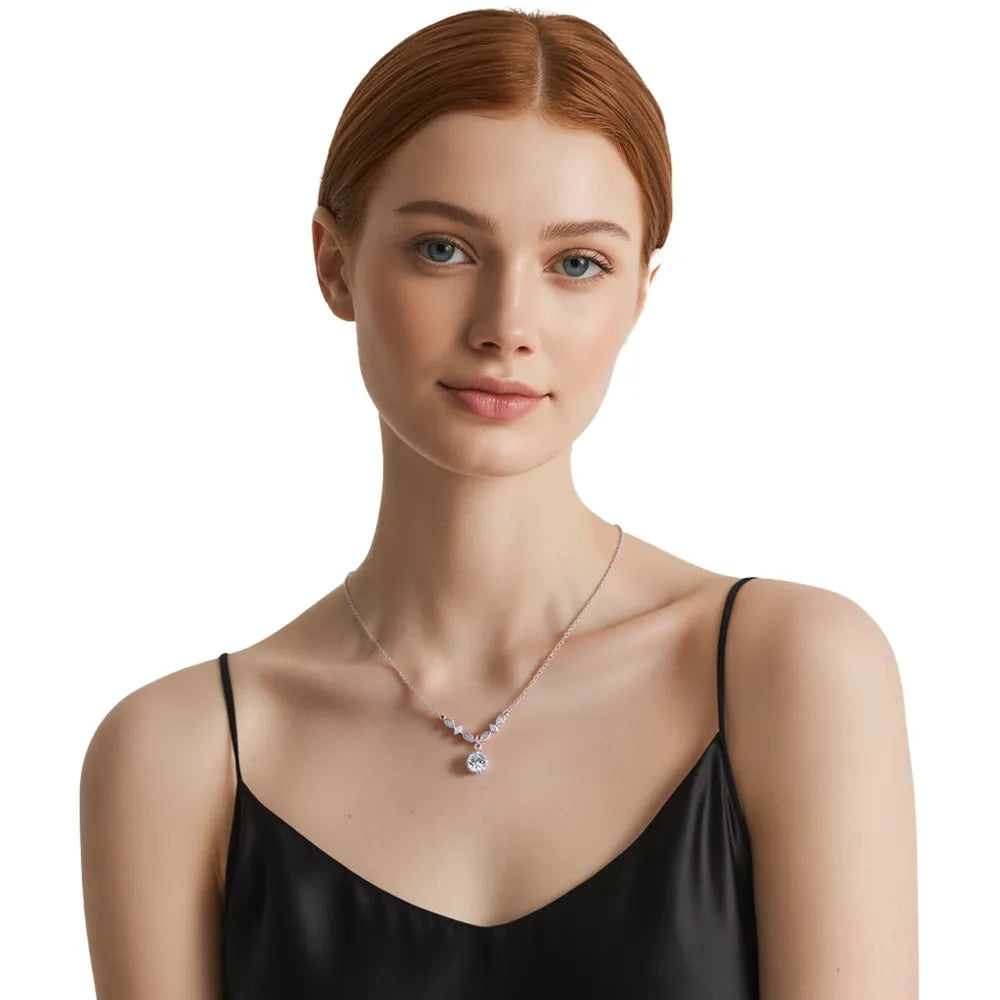 Model wearing a sparkling moissanite drop necklace with a black evening dress, showcasing the elegant floral design
