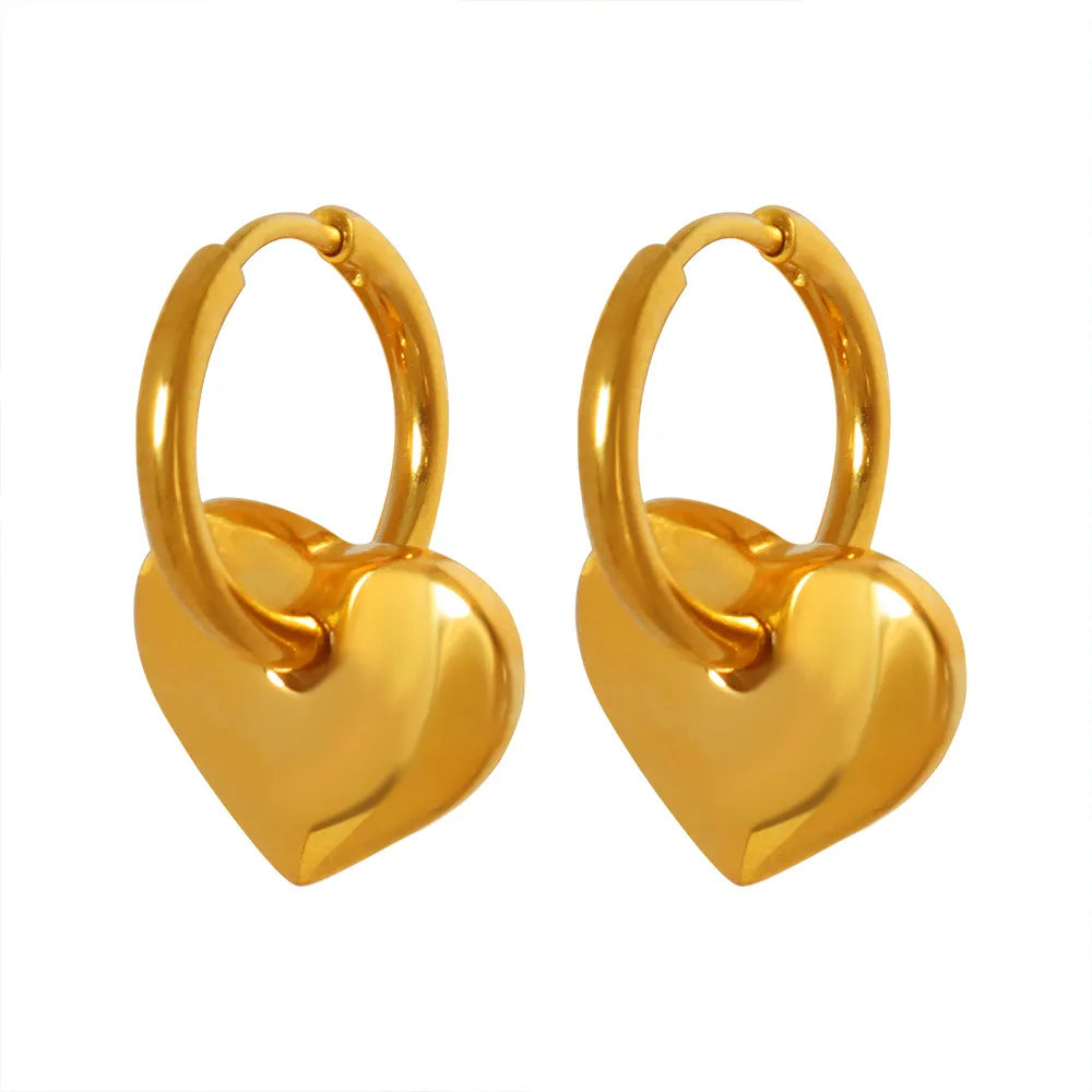 18K gold plated hoop earrings with a dangling puffy heart charm on a white background