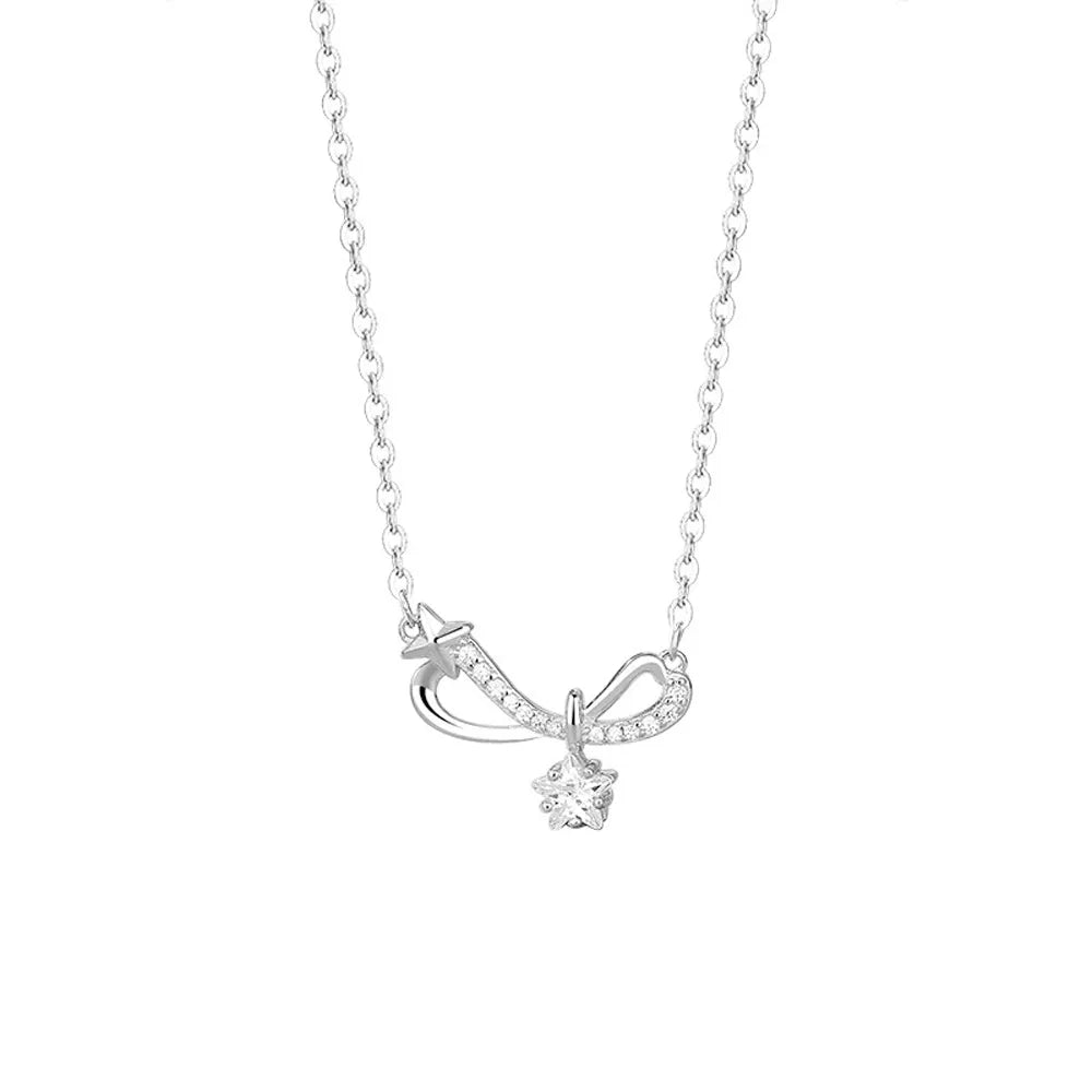 S925 sterling silver pavé infinity bow necklace with a solitaire star charm on a white background