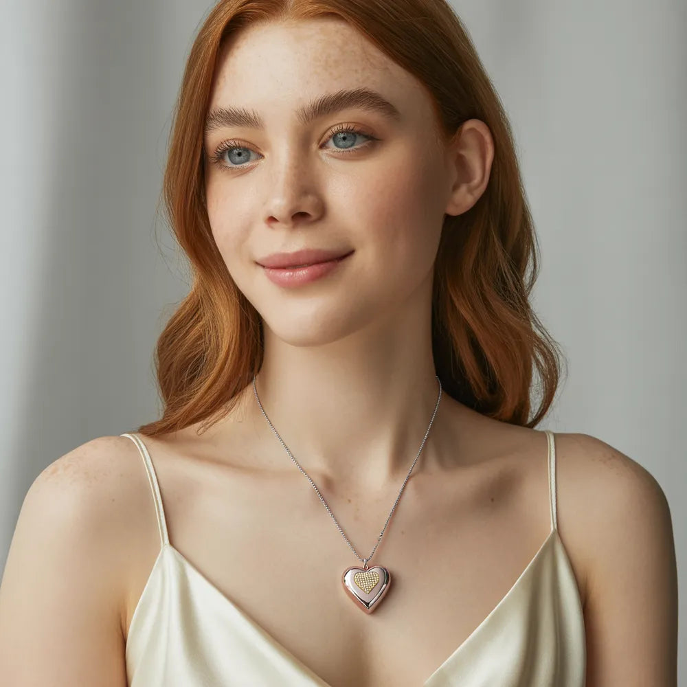 A woman showcasing the 316L stainless steel puffy heart necklace with its gold zirconia accent