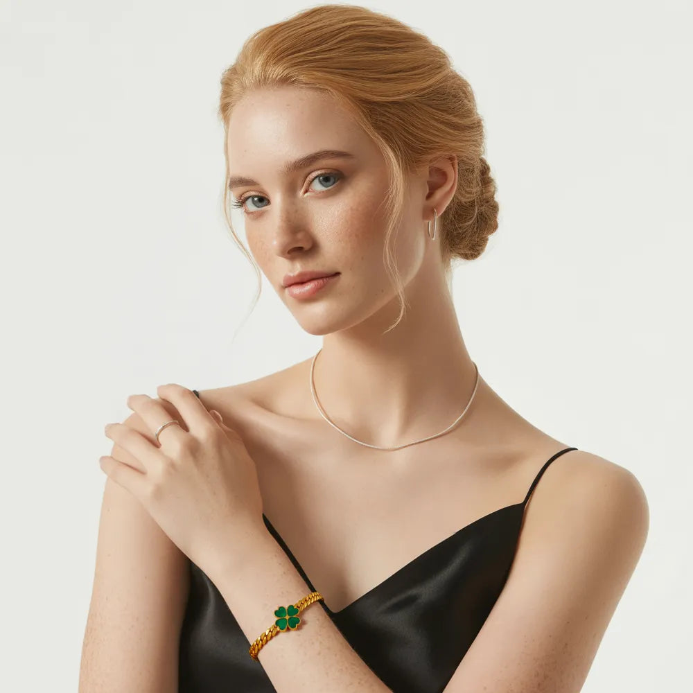 The Clover herringbone bracelet worn by a model to demonstrate its fit and scale.