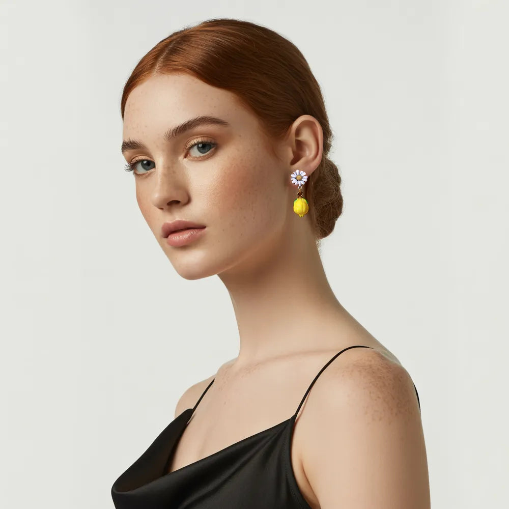 Model looking forward while wearing the whimsical Daisy Bloom Lemon Drop Earrings.