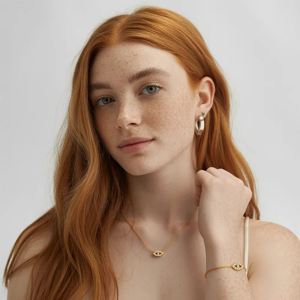 Model with red hair wearing the complete Iris Pavé Eye Charm Set for protection