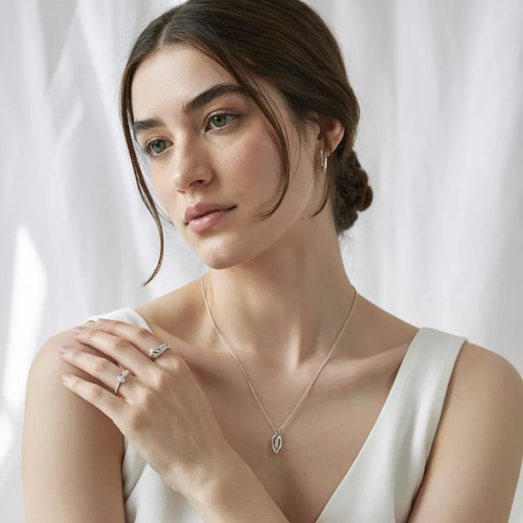 Model wearing an S925 sterling silver pendant necklace with a minimalist design.