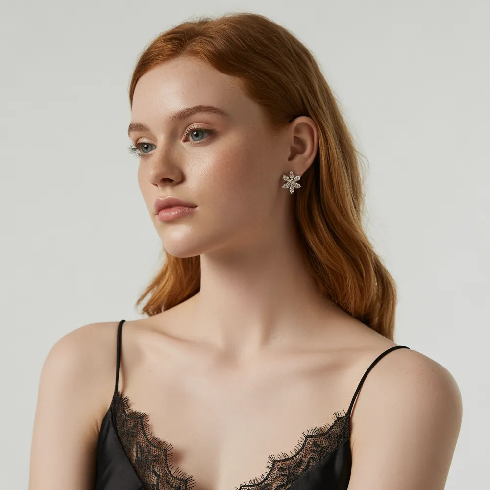 A model's ear stack featuring several of the most popular stud earrings from the GlamBodyCandy best sellers collection