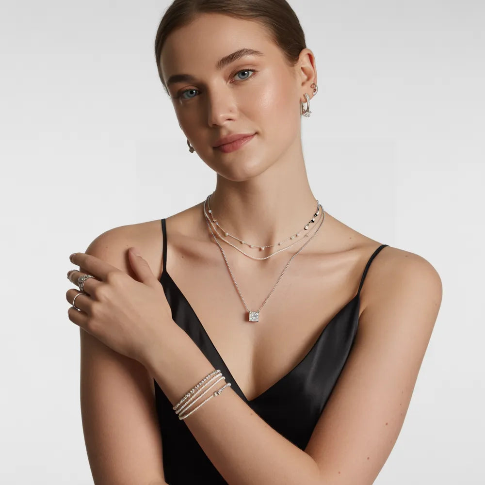A model wearing the Luna Star sterling silver pendant necklace to showcase its delicate style