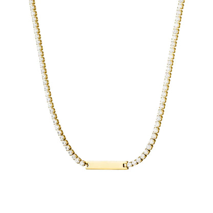 Studio shot of an 18K gold plated stainless steel necklace featuring a crystal tennis chain with a polished rectangular bar pendant, isolated on white.