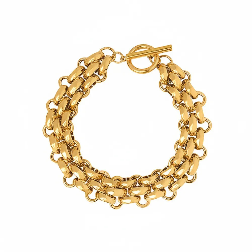Studio shot of an 18K gold plated stainless steel bracelet with thick chunky links and a front toggle clasp, isolated on white.