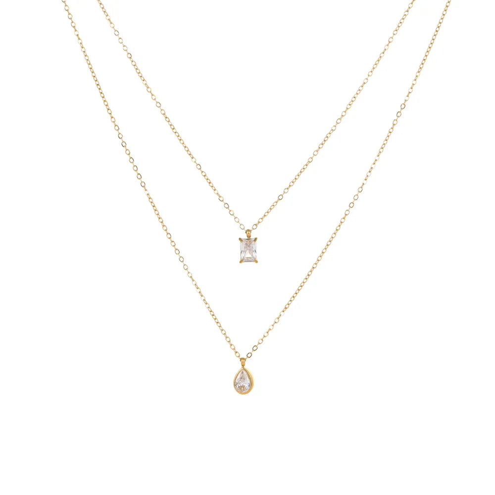 18K gold plated double layered necklace featuring a rectangle emerald-cut zircon and a teardrop pendant on a white background