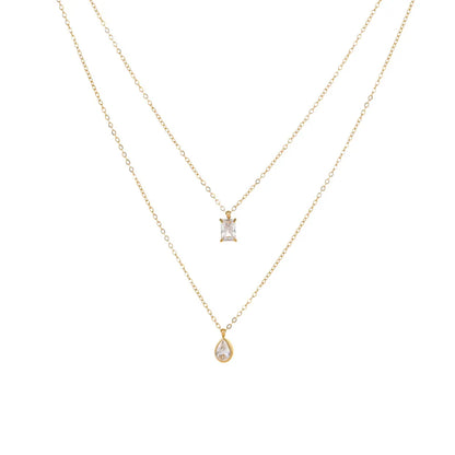 18K gold plated double layered necklace featuring a rectangle emerald-cut zircon and a teardrop pendant on a white background