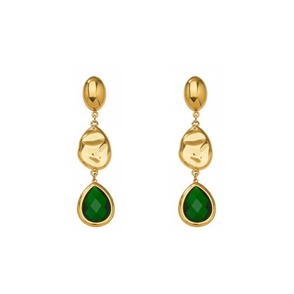 Studio shot of 18K gold plated drop earrings featuring a faceted emerald green glass teardrop stone and textured gold accents, isolated on white