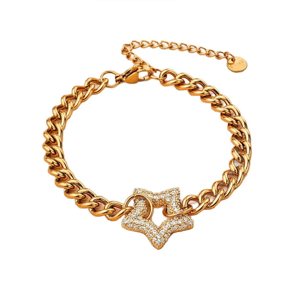 18K gold plated chunky curb chain bracelet featuring a sparkling pave cubic zirconia star connector, isolated on a white background.