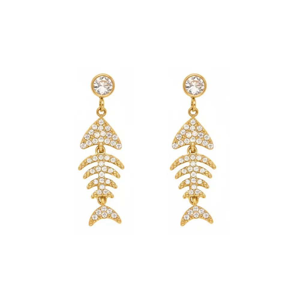 Studio shot of 18K gold plated articulated fish bone earrings paved with sparkling cubic zirconia, isolated on white.