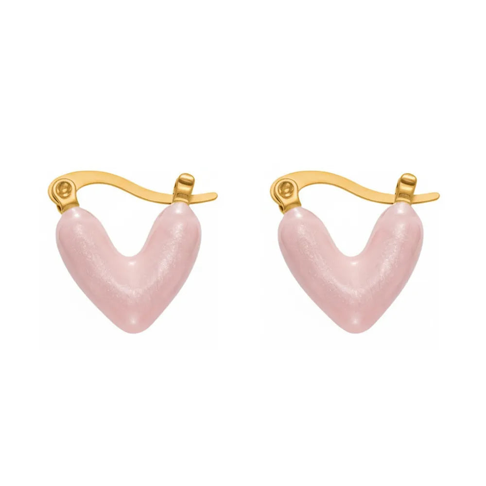 Studio shot of 18K gold plated huggie earrings featuring a puffy pink enamel heart design, isolated on white