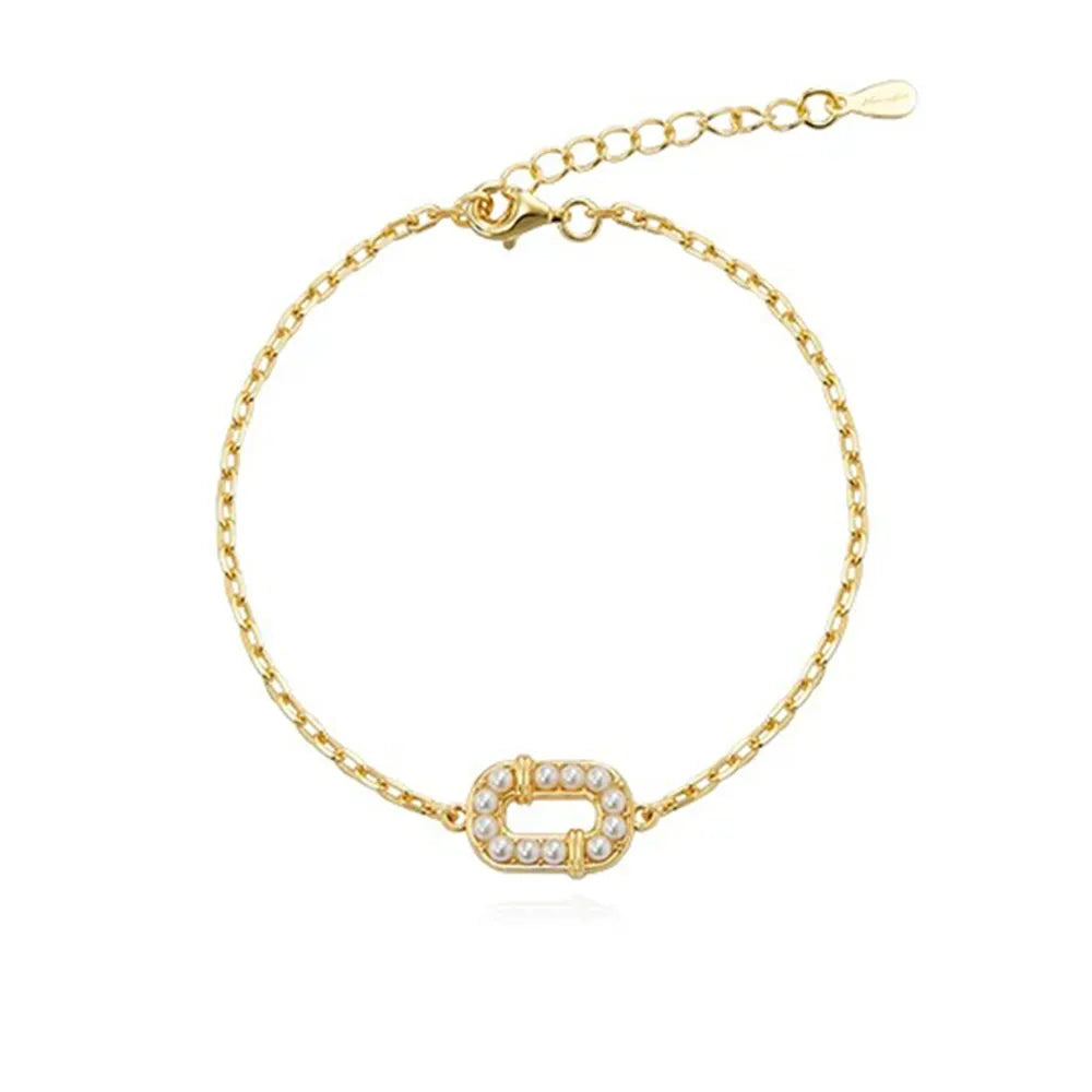 Front view of 18K gold plated S925 silver bracelet featuring an oval frame lined with micro pearls.