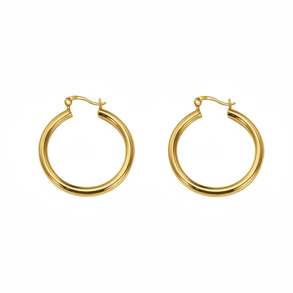 Studio shot of 18K gold plated S925 sterling silver chunky hoop earrings with a high-polished finish, isolated on white.