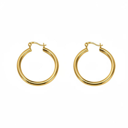 Studio shot of 18K gold plated S925 sterling silver chunky hoop earrings with a high-polished finish, isolated on white.