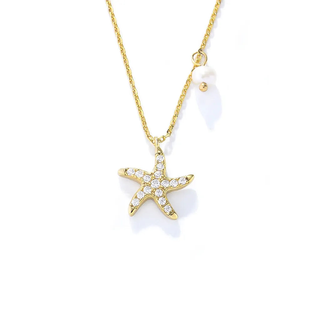 Front view of 18K gold plated S925 silver necklace with a pave starfish pendant and side pearl.