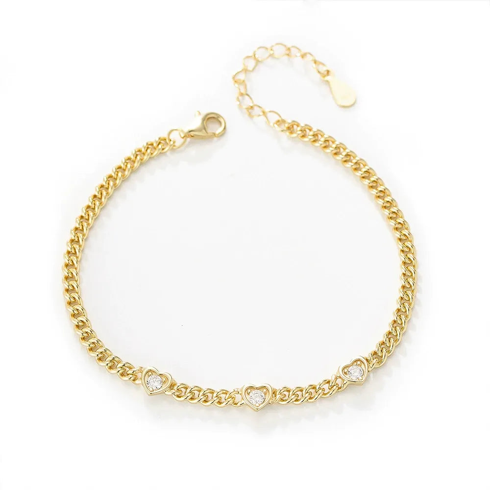 Front view of 18K gold plated Cuban link bracelet adorned with sparkling heart-shaped gemstones