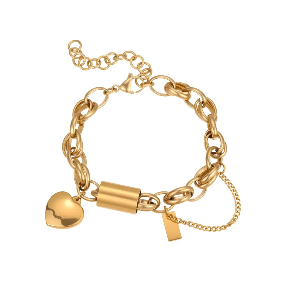 18K gold plated chunky chain bracelet featuring a polished puffy heart pendant and cylinder bar charm isolated on white.