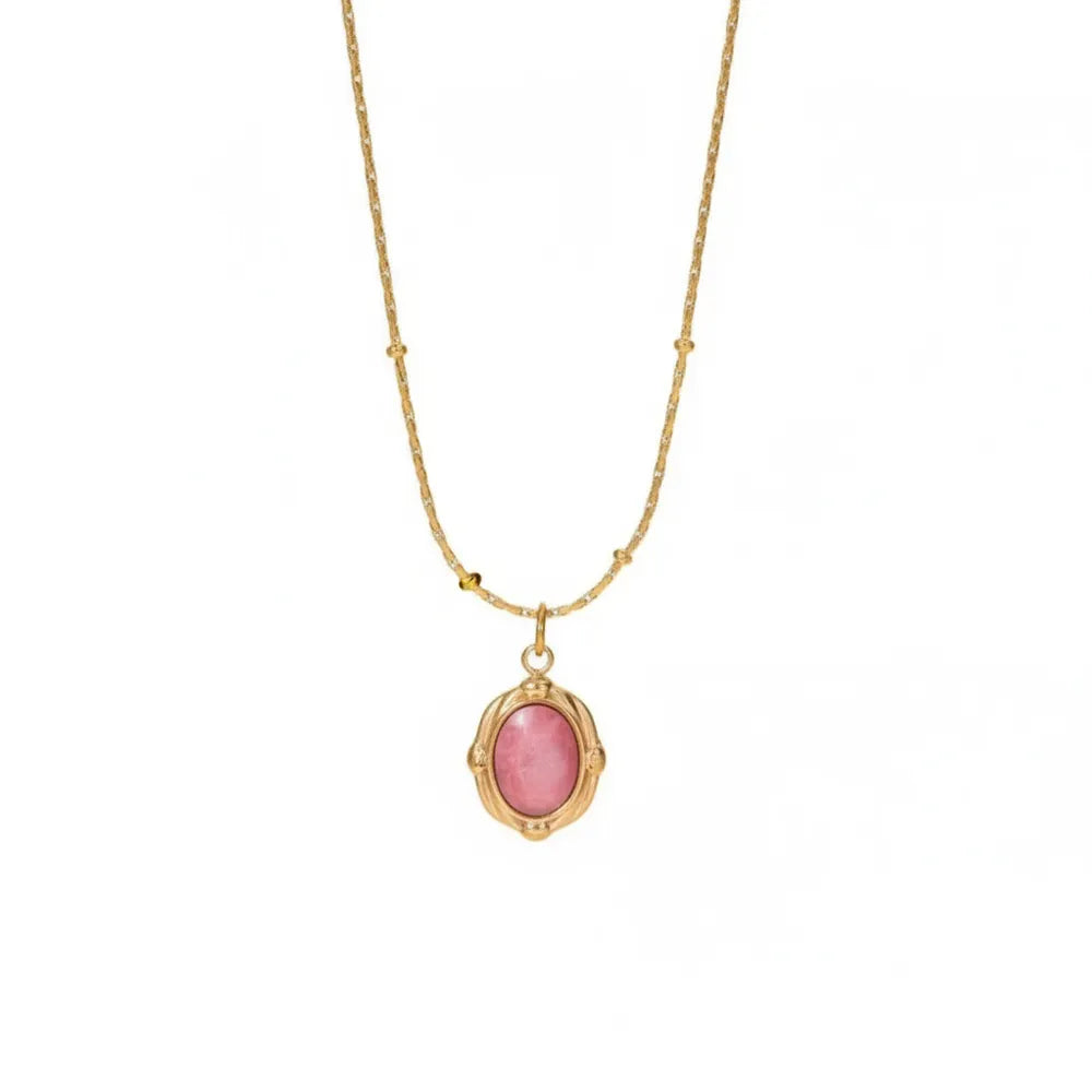 18K gold plated necklace featuring a natural oval rhodochrosite stone pendant suspended from a beaded satellite chain, isolated on white.