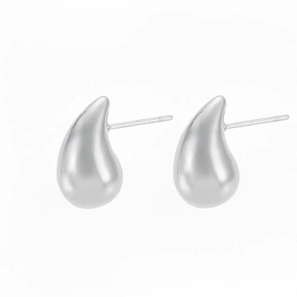 Pair of Aella Teardrop Stud Earrings in polished 316L stainless steel.