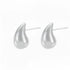 Pair of Aella Teardrop Stud Earrings in polished 316L stainless steel.