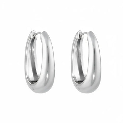 Pair of Anya Sculptural Hoop Earrings in polished 316L stainless steel.

