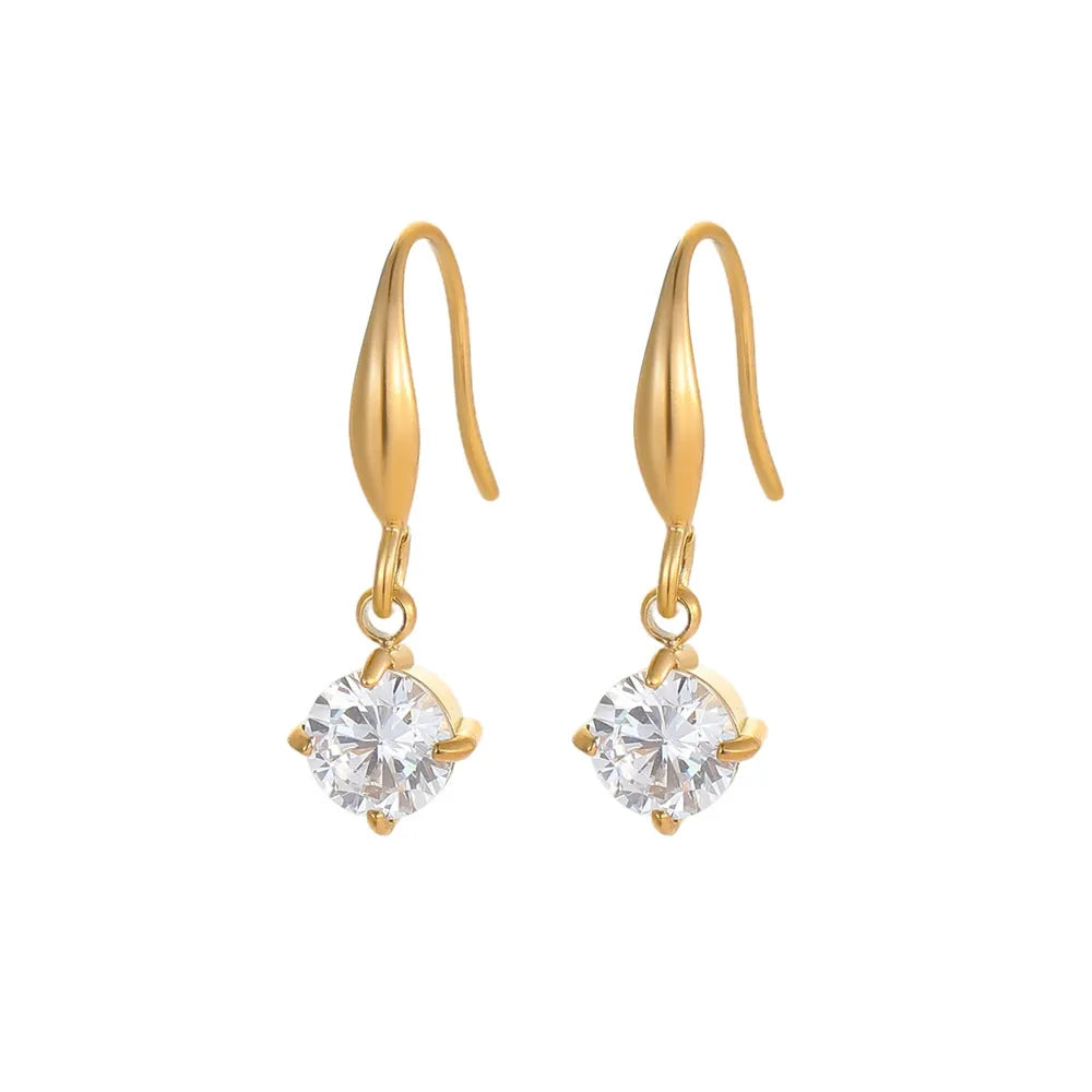 Pair of Astra Solitaire Dangle Earrings in 18k gold with a round zirconia stone.

