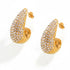The Aura Teardrop Stud Earrings in 18k gold plate, featuring a full pavé zirconia setting, on a white background.