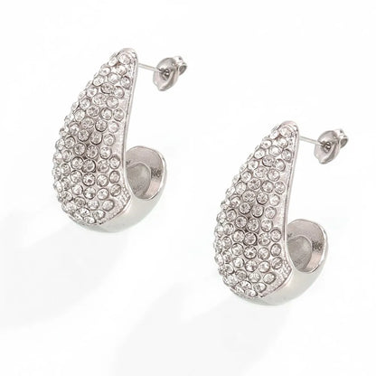 A product shot of the Aura Teardrop Stud Earrings in a polished stainless steel silver finish