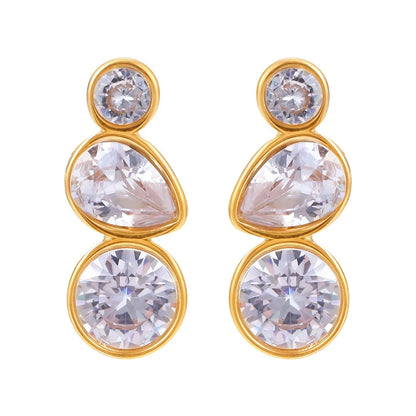Pair of geometric triple-stone stud earrings (round, pear, round) in 18k gold on white background.
