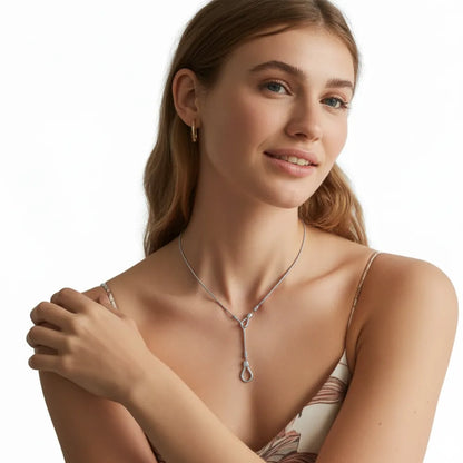Model wearing the polished stainless steel Cleo Adjustable Lariat Necklace.