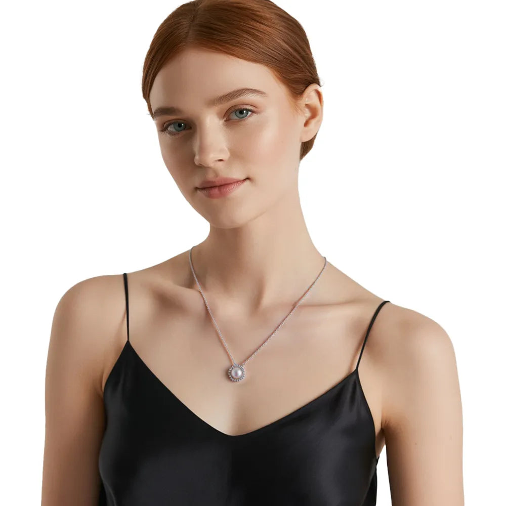 Woman showcasing a sophisticated silver pearl necklace suitable for weddings or formal events.