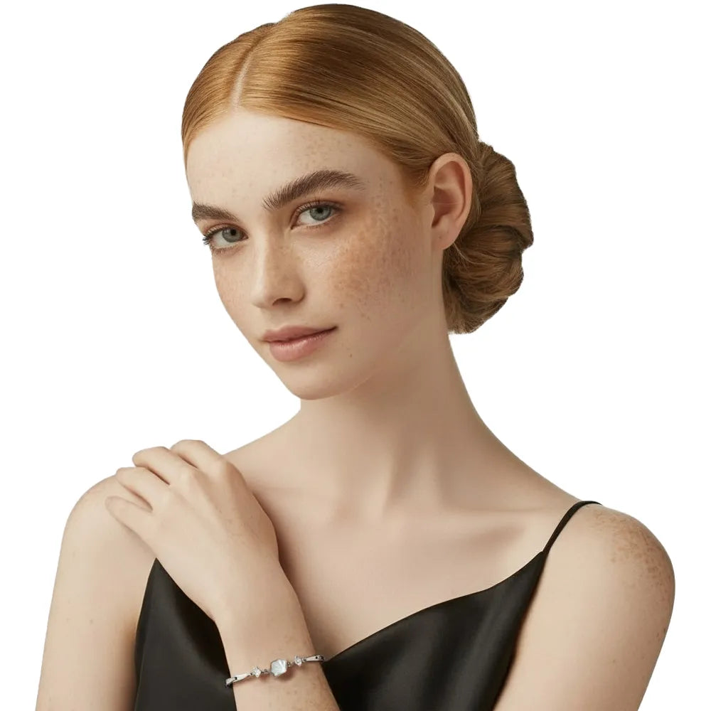 Model wearing an elegant silver shell bracelet, symbolizing a lifetime of love.