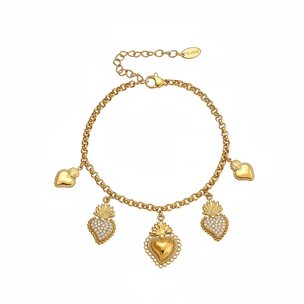 18k gold rolo chain bracelet with dangling sacred heart charms on white background.