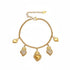 18k gold rolo chain bracelet with dangling sacred heart charms on white background.